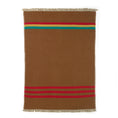 Load image into Gallery viewer, Cozy Manitoba Collection linen-wool throw featuring a neutral plaid background with bold red, green, and mustard stripes, finished with a flax-colored fringe. Crafted from premium Belgian Linen™, this throw combines softness and warmth, perfect for adding style to any room.