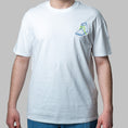 Load image into Gallery viewer, White organic cotton t-shirt with blue and green embroidered shoe illustration on chest, Gordina