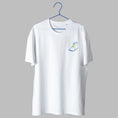 Load image into Gallery viewer, A white t-shirt on a blue wire hanger against a light grey background. It features a small embroidered design on the left chest showing a blue outline of a foot wearing a shoe with bright green laces.