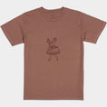 Load image into Gallery viewer, La Bailarina terracotta T-shirt laid flat with the dancing-figure motif centred on the chest