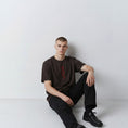 Bild in Galerie-Betrachter laden, The Papyrus embroidered T-shirt in coal with hieroglyphic-style motif, alternate front view