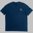 Load image into Gallery viewer, Close-up of navy organic cotton t-shirt with orange and blue abstract head embroidery, Gordina