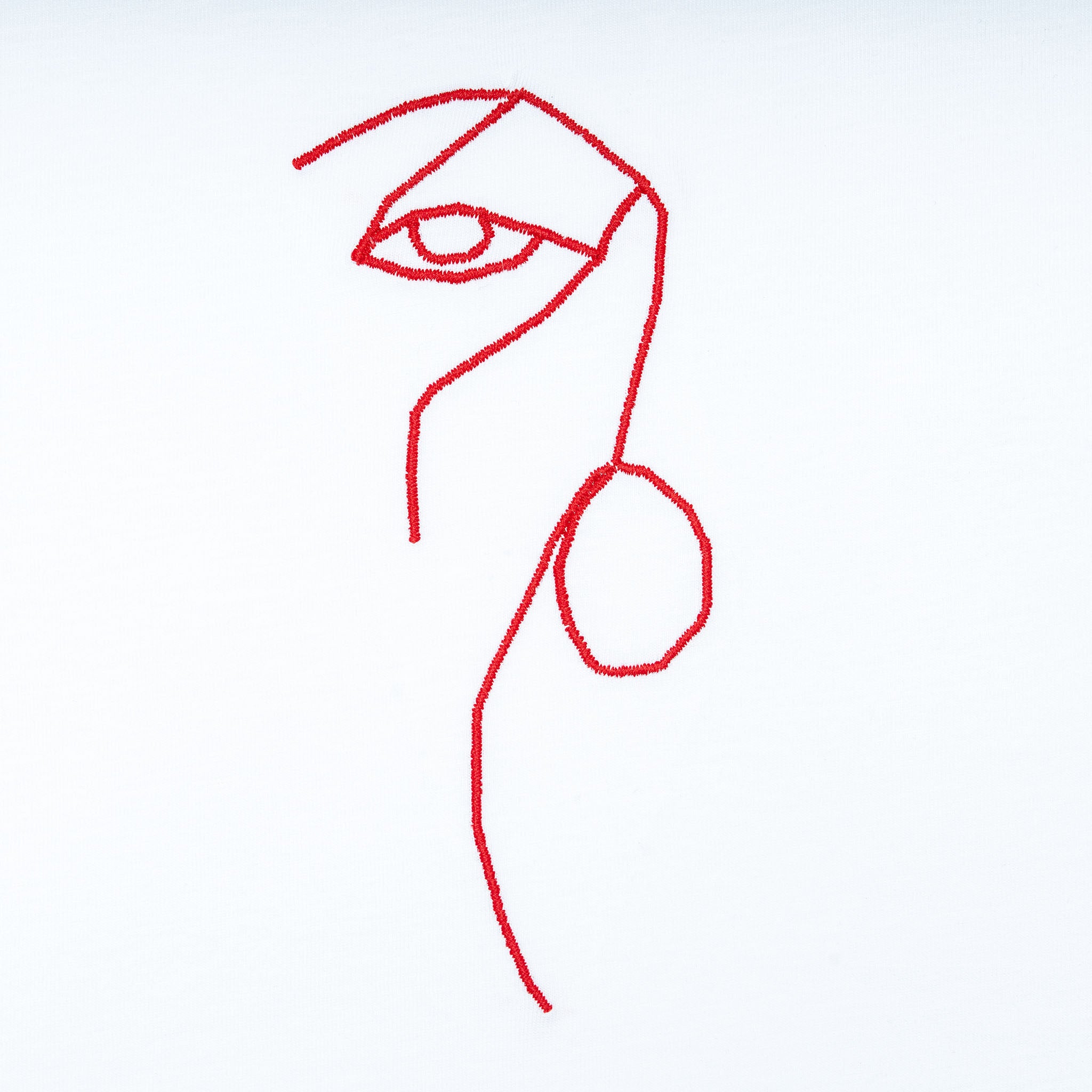 Close-up of white organic cotton t-shirt with minimalist red line face embroidery, Gordina
