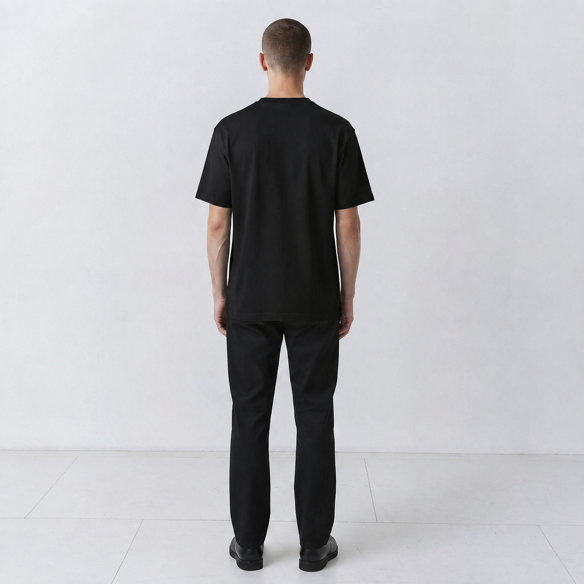 Undeciphered embroidered T-shirt in black, plain back view