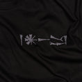 Charger l'image dans la visionneuse de la galerie, Close-up of embroidery detail on Undeciphered T-shirt
