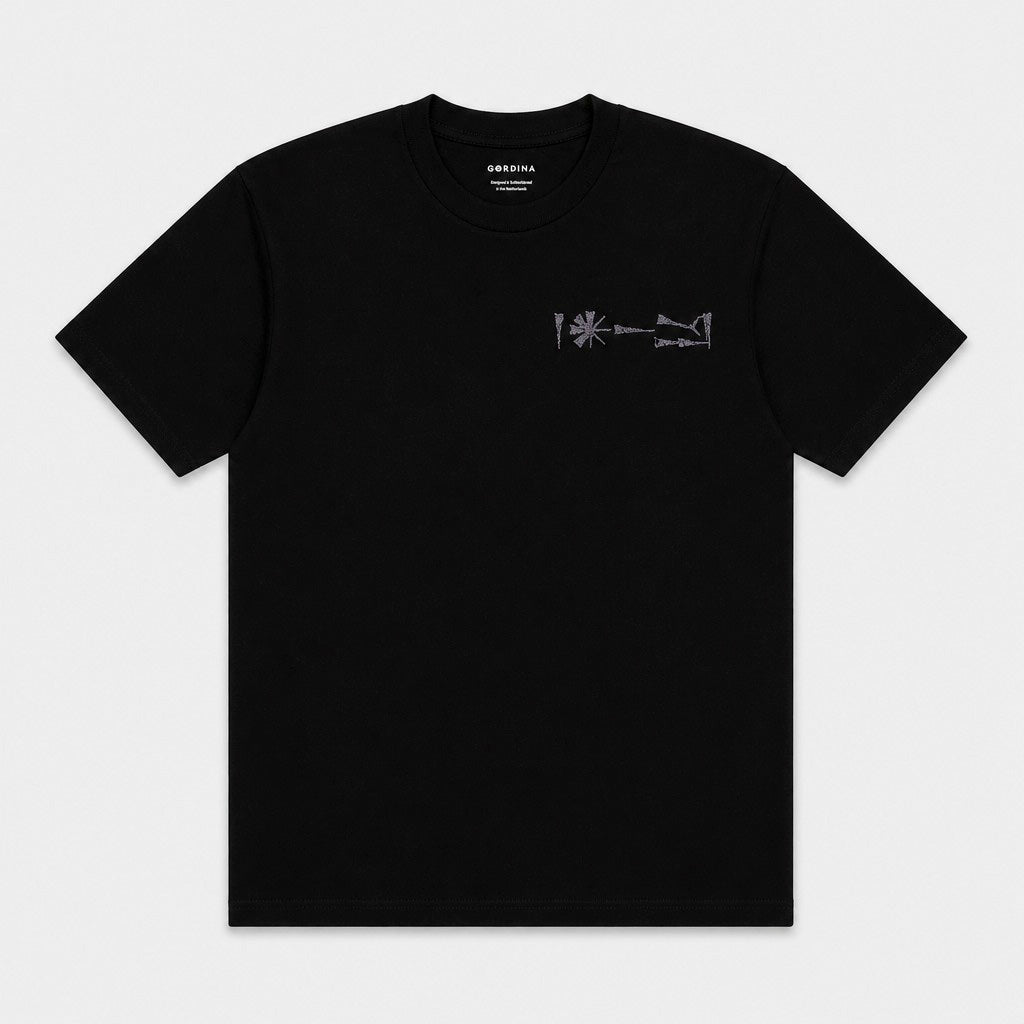 Flat lay of Undeciphered black T-shirt showing chest motif