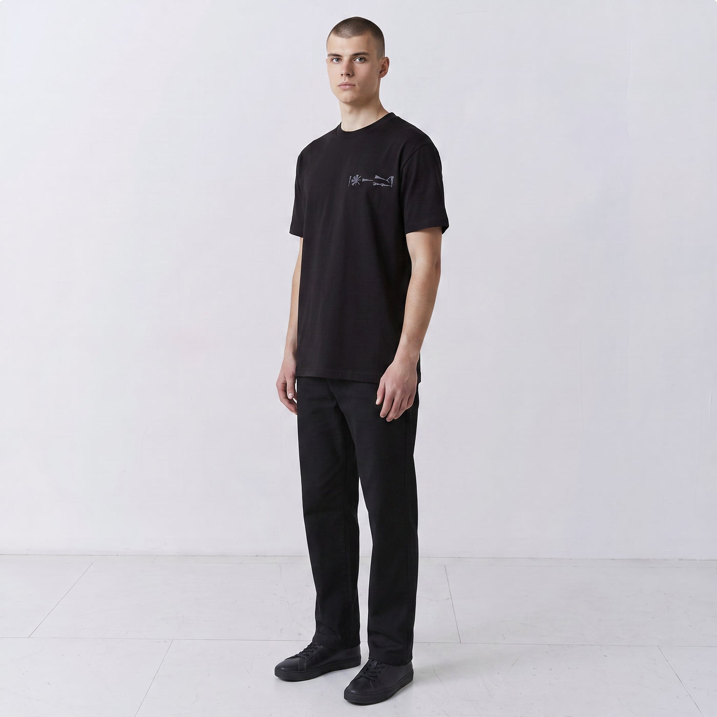 Undeciphered embroidered T-shirt in black, small chest motif, front view