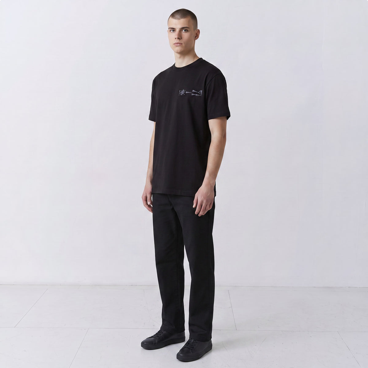 Undeciphered embroidered T-shirt in black, small chest motif, front view
