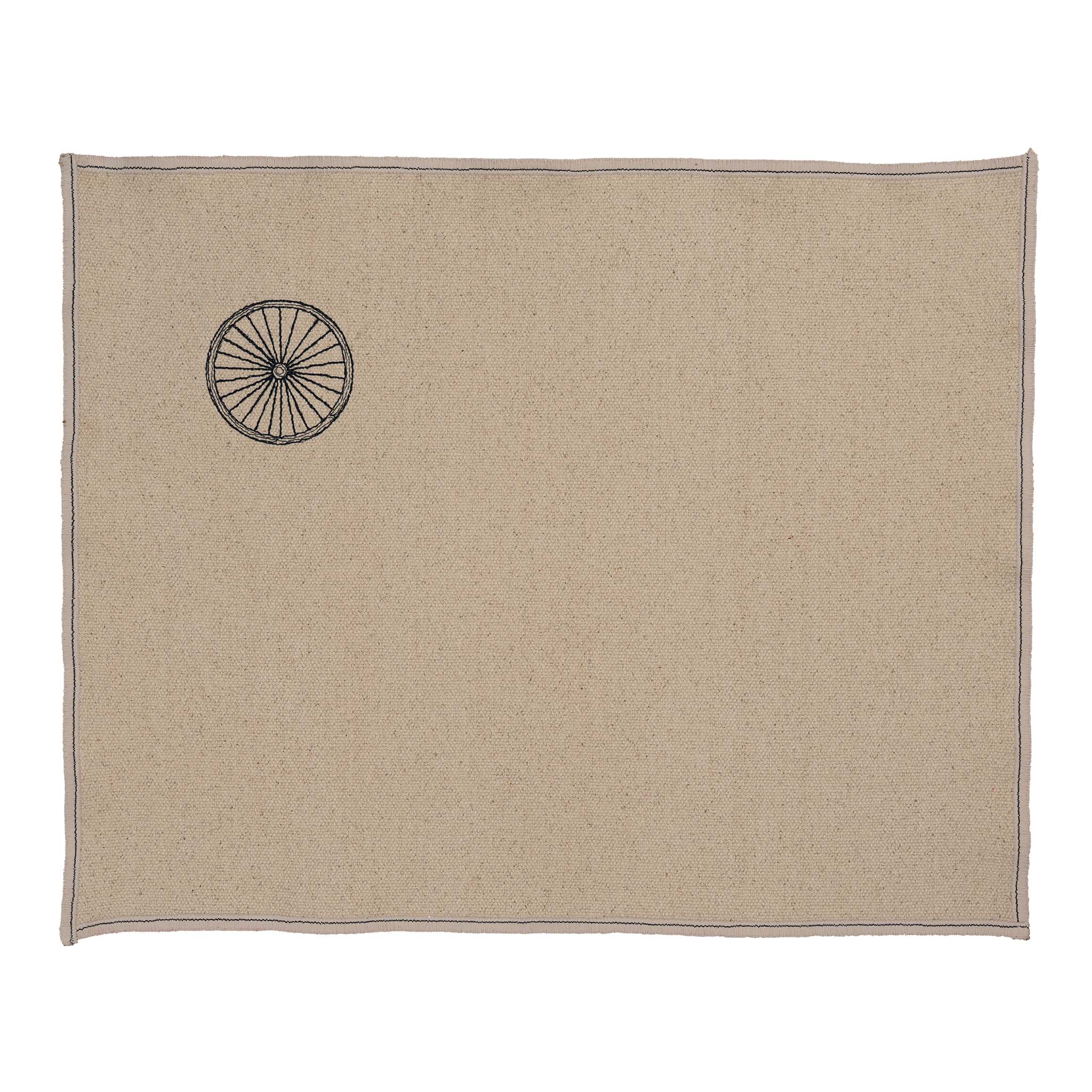 “Gordina beige cotton placemat with embroidered wheel motif – handcrafted table textile”