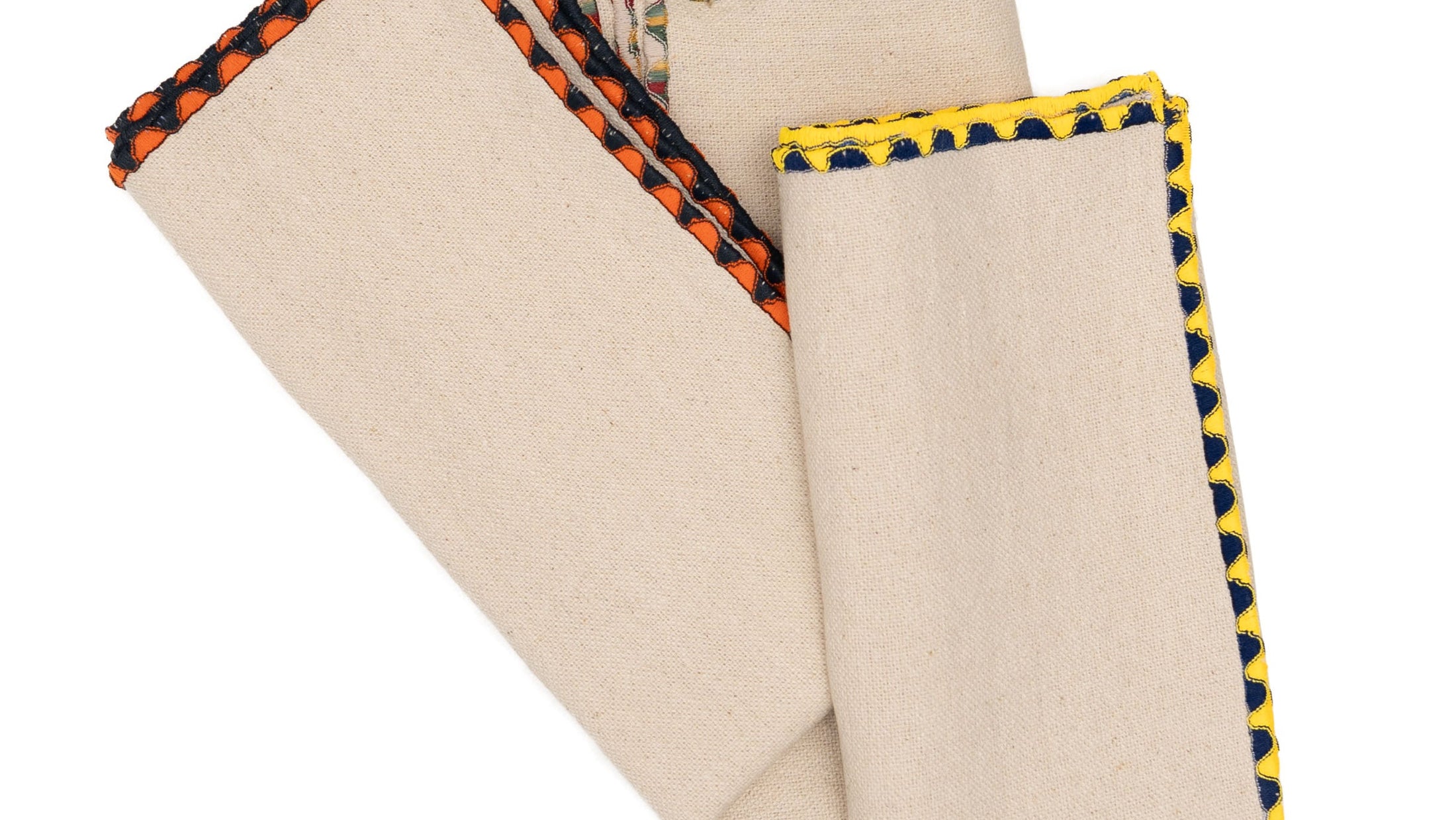 Cotton napkins with contrast edge stitching from Gordina’s seasonal collections, folded on a white background