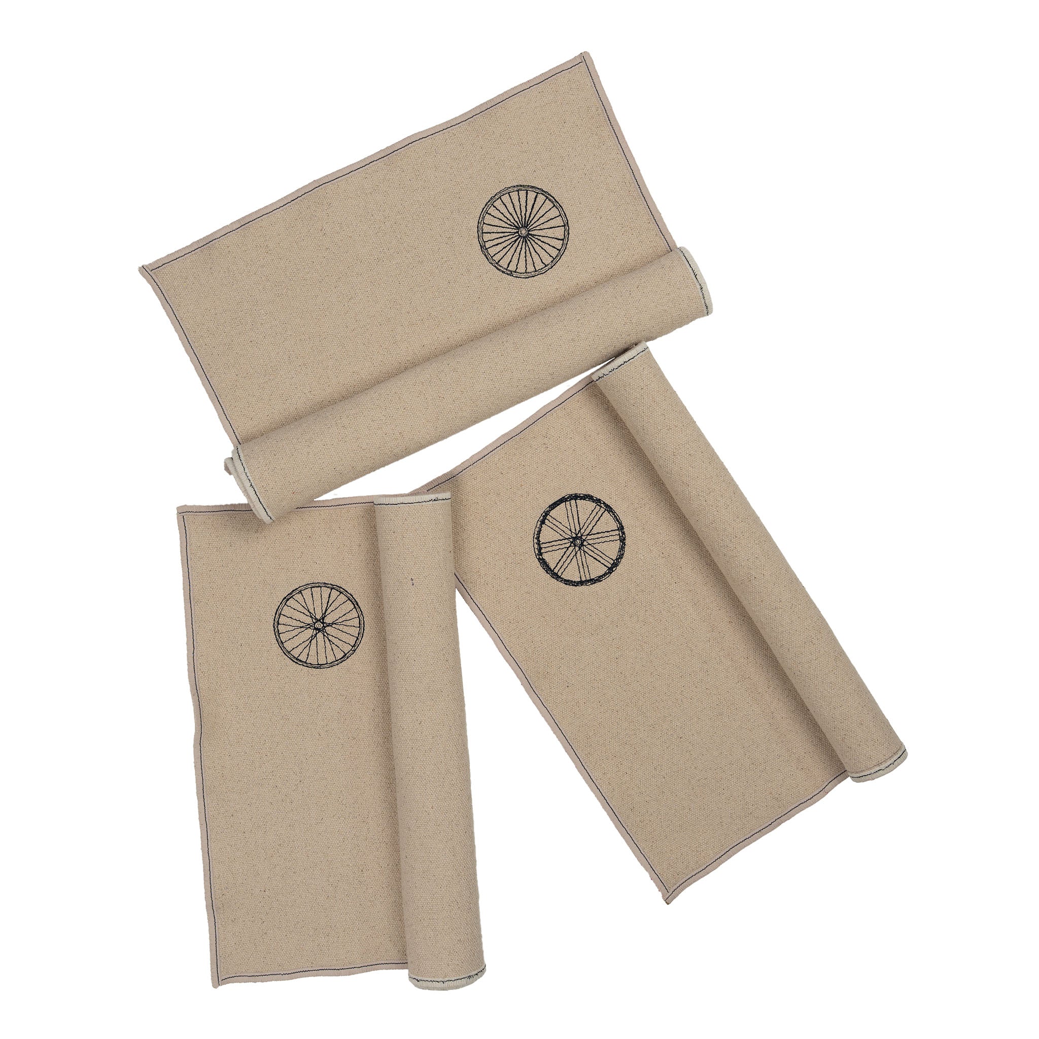“Gordina beige cotton placemat with embroidered wheel motif – handcrafted table textile. winter table setting inspiration.