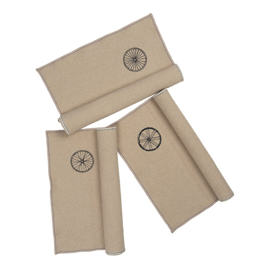 “Gordina beige cotton placemat with embroidered wheel motif – handcrafted table textile. winter table setting inspiration.