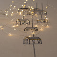 Load image into Gallery viewer, Handmade embroidered cotton tablecloth featuring connected houses, designed to evoke warmth and togetherness.
