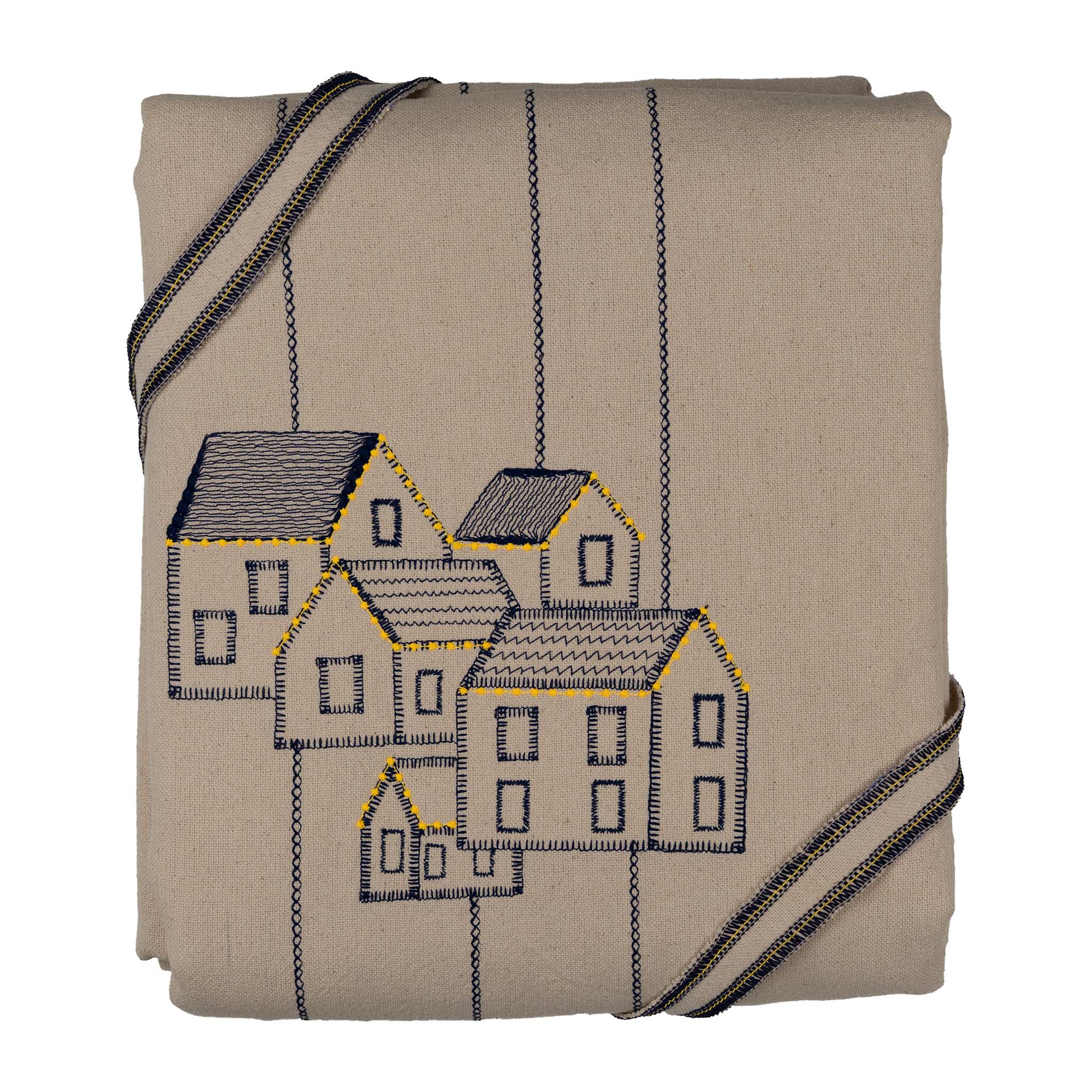 Handmade embroidered cotton tablecloth featuring connected houses, designed to evoke warmth and togetherness.
