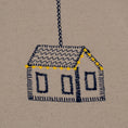 Load image into Gallery viewer, Handmade embroidered cotton tablecloth featuring connected houses, designed to evoke warmth and togetherness.

