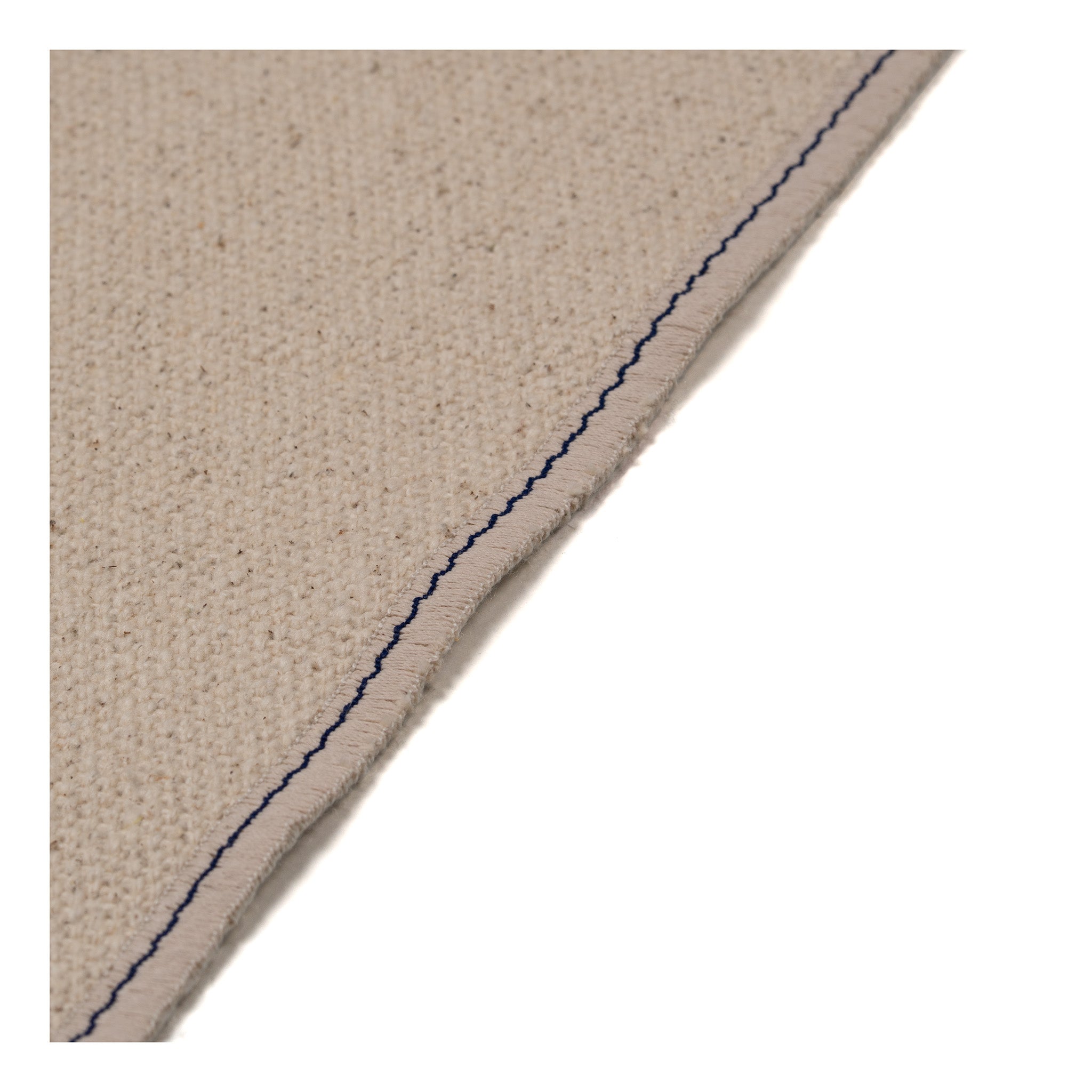 Set of four embroidered cotton placemats with connected house motifs, celebrating family, home, and craftsmanship.
