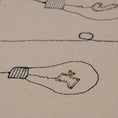 Load image into Gallery viewer, Handmade embroidered cotton tablecloth with festive light bulb design, crafted in the Netherlands for holiday gatherings.

