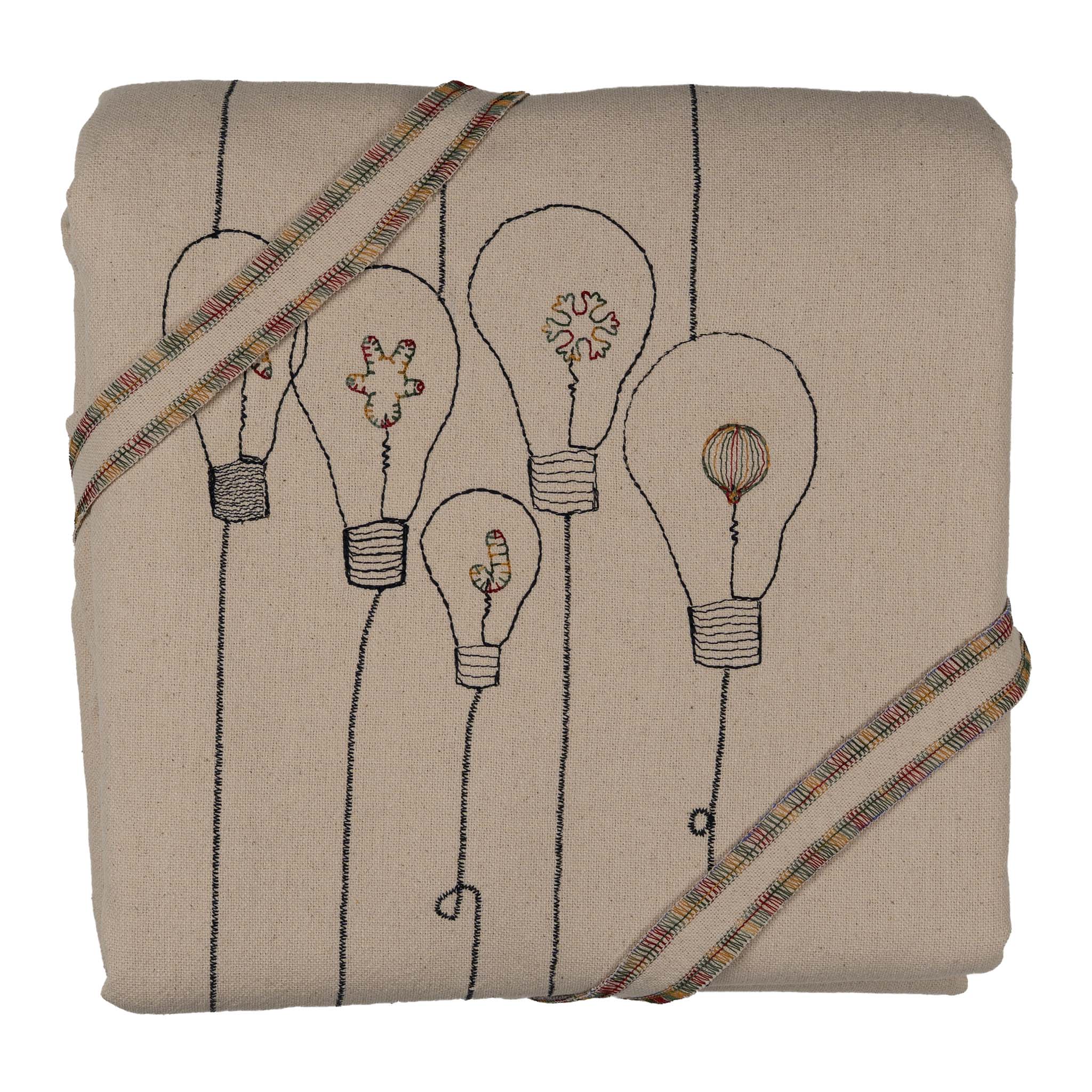 Handmade embroidered cotton tablecloth with festive light bulb design, crafted in the Netherlands for holiday gatherings.
