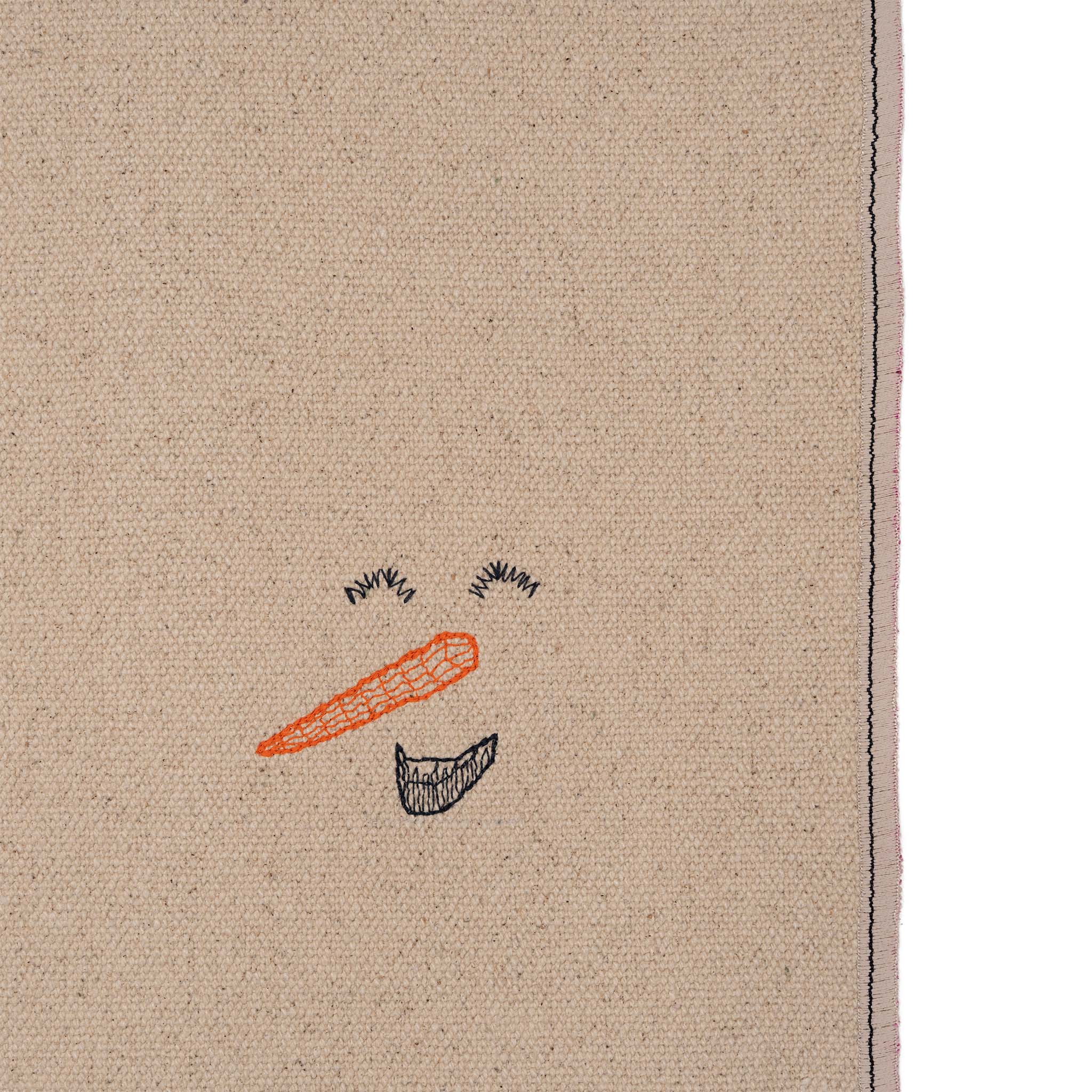 Set of four embroidered cotton placemats with playful snowman design, handmade for winter dining and festive tables.
