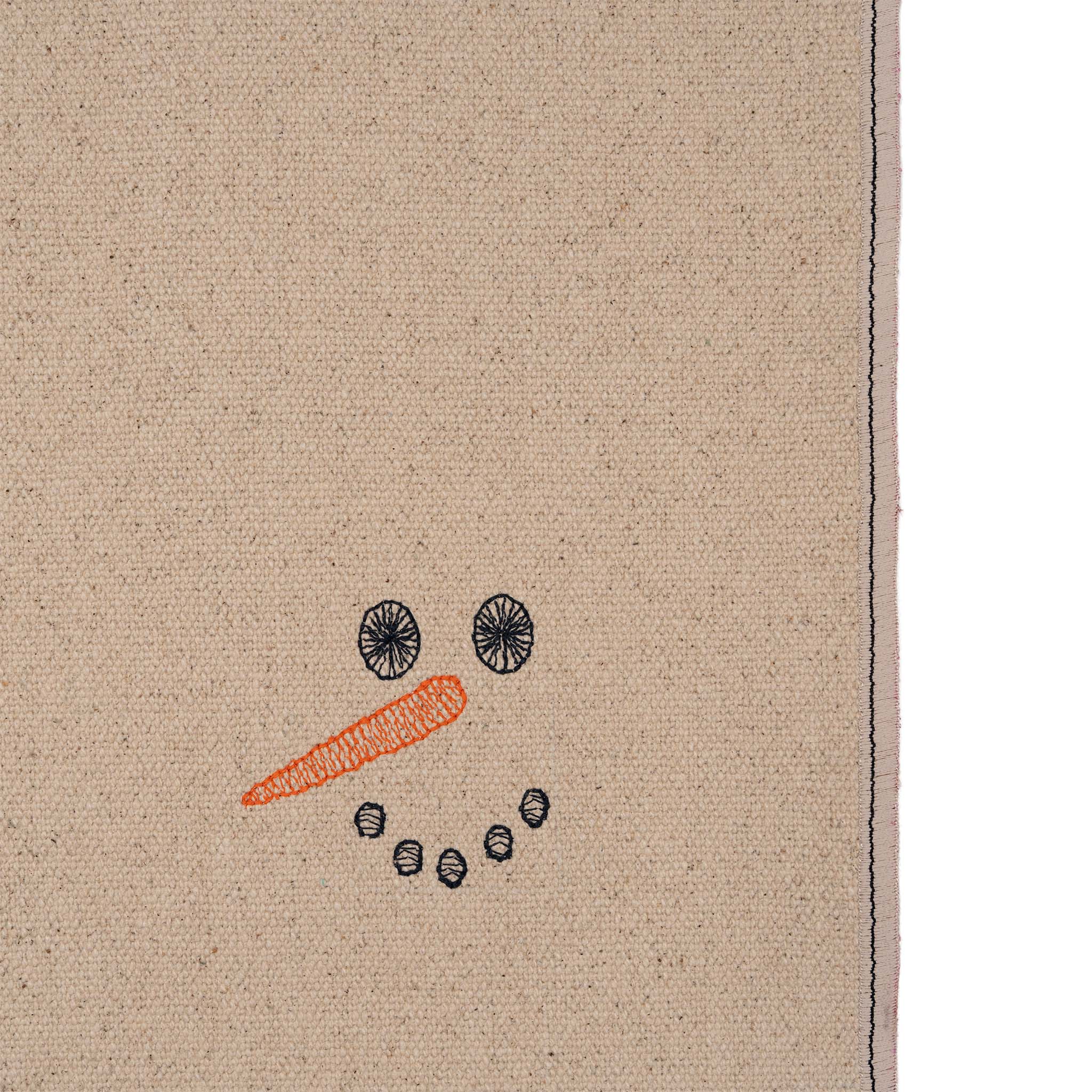 Set of four embroidered cotton placemats with playful snowman design, handmade for winter dining and festive tables.
