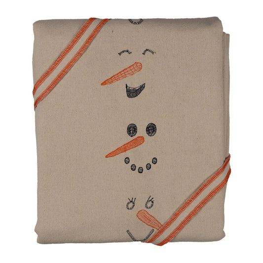Winter-inspired embroidered cotton tablecloth with snowman motif, symbolizing childlike joy and family moments.
