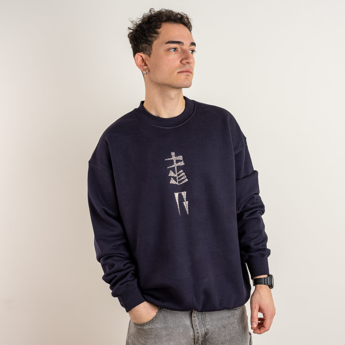 Angled view of the Garden and Water embroidered ink blue men's crewneck sweatshirt by Gordina
