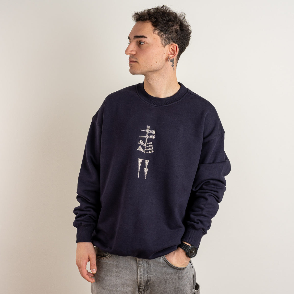 Side view of Gordina Garden and Water ink blue cotton sweatshirt with vertical chest embroidery