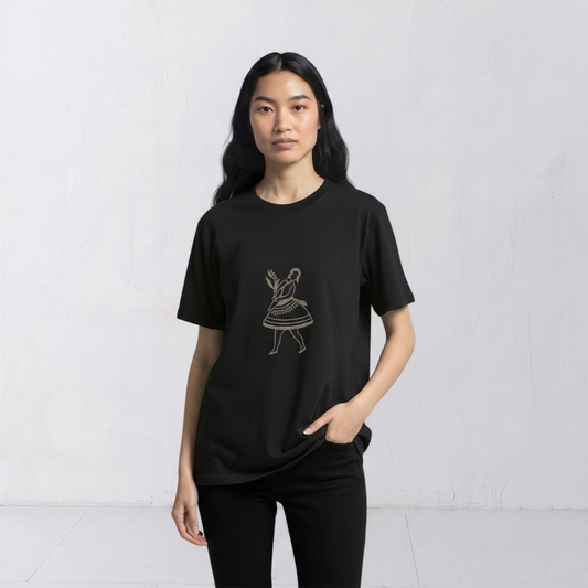 Model wearing the La Bailarina black T-shirt with a cream-thread dancing figure embroidered at the centre chest