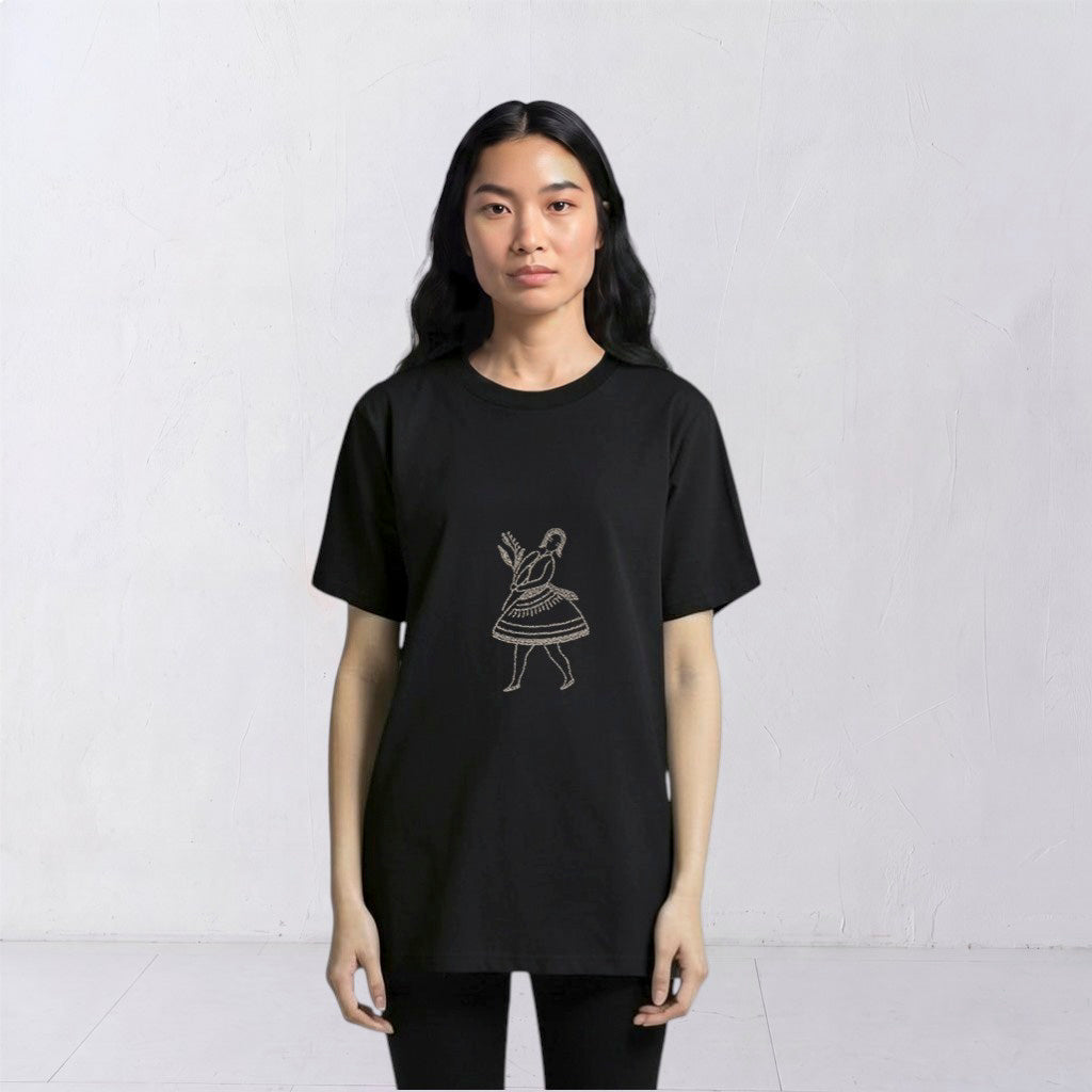 Close front view of the La Bailarina embroidered motif on a black T-shirt