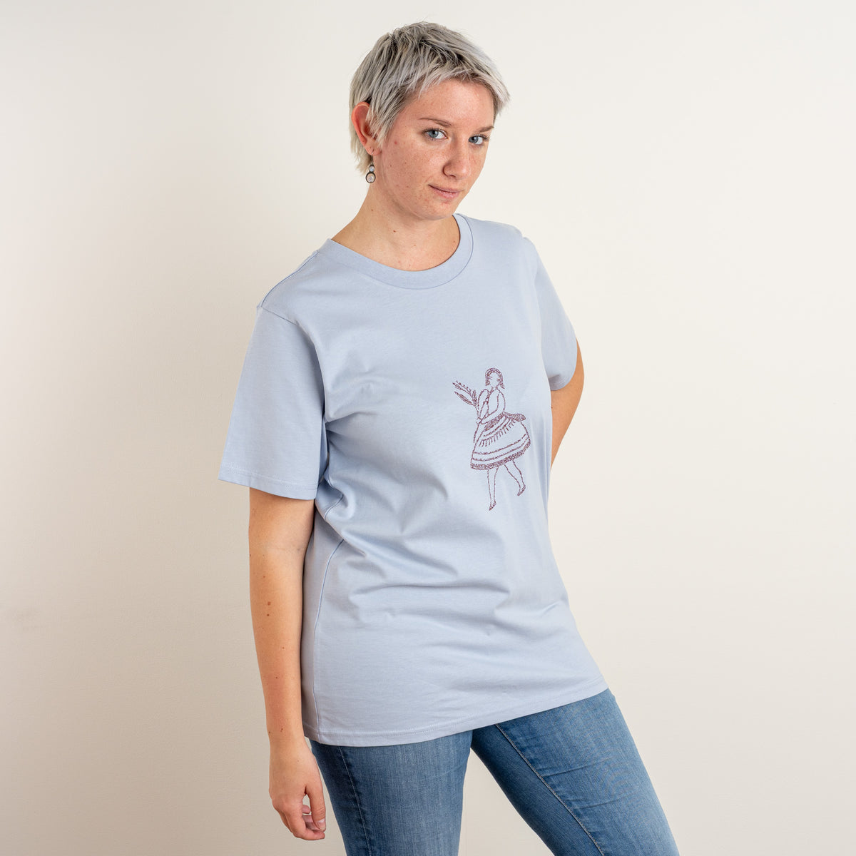 Front view of a woman wearing the Powder La Bailarina embroidered cotton T-shirt, made in Gordina’s Netherlands studio.