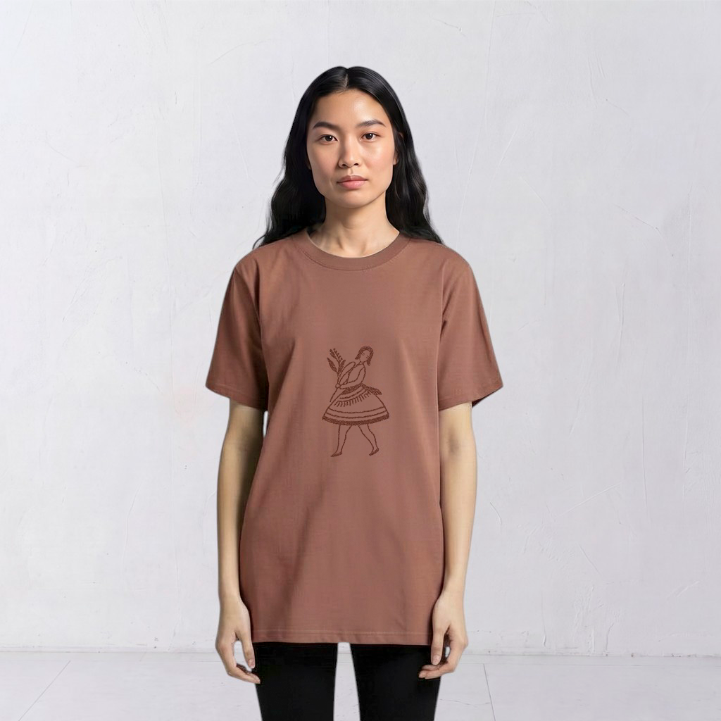 Model wearing the La Bailarina terracotta T-shirt with a dark-thread dancing figure embroidered at the centre chest