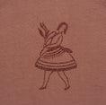 Load image into Gallery viewer, Close-up of the dancer’s embroidered skirt and fringe on the La Bailarina terracotta T-shirt
