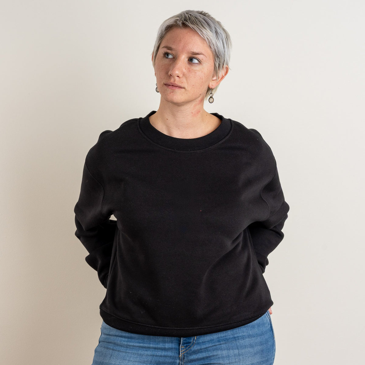 Woman wearing the black personalised Women’s Relaxed Sweatshirt, front view