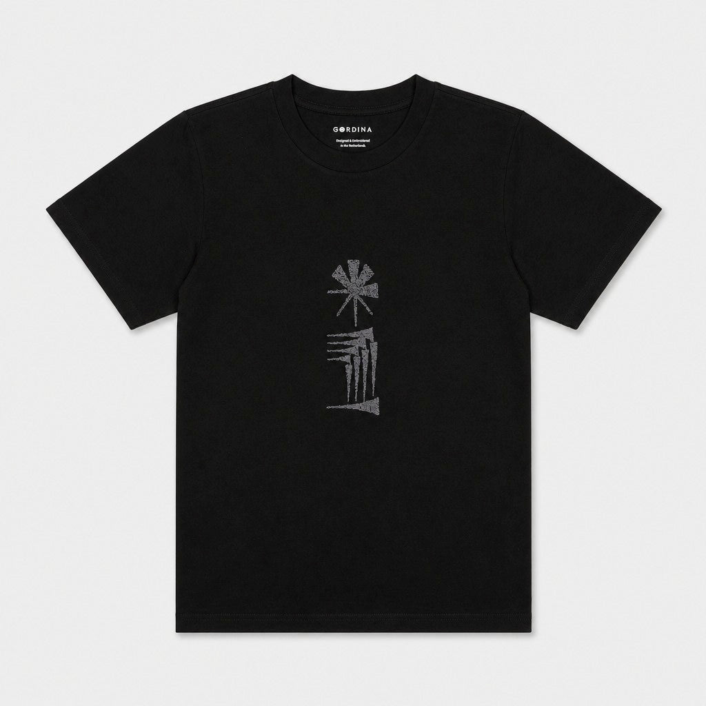 Star and House black T-shirt flat lay showing the embroidered chest motif