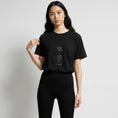 Load image into Gallery viewer, Star and House black T-shirt with cuneiform embroidery, model front view
