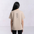 Bild in Galerie-Betrachter laden, The Papyrus women’s embroidered T-shirt in bone with a vertical hieroglyphic-style upper-back motif
