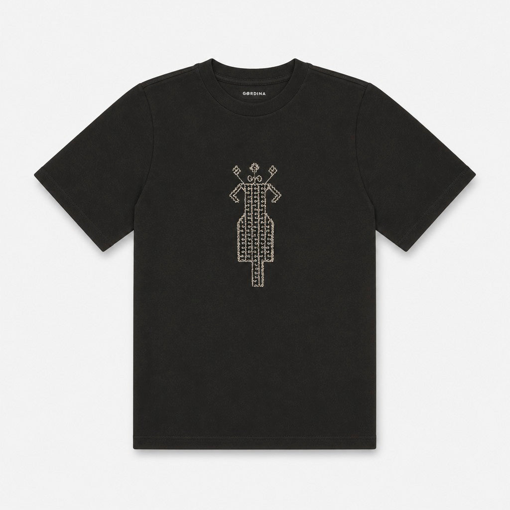 The Ward Faded Black women’s T-shirt flat lay showing the cream embroidery