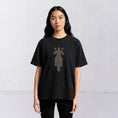 Bild in Galerie-Betrachter laden, The Ward Faded Black women’s T-shirt with cream horse-and-rider embroidery, front view
