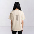 Bild in Galerie-Betrachter laden, The Ward Faded Bone women’s T-shirt with reddish horse-and-rider embroidery, back view
