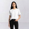 Load image into Gallery viewer, Water and Garden white T-shirt, model three-quarter front view
