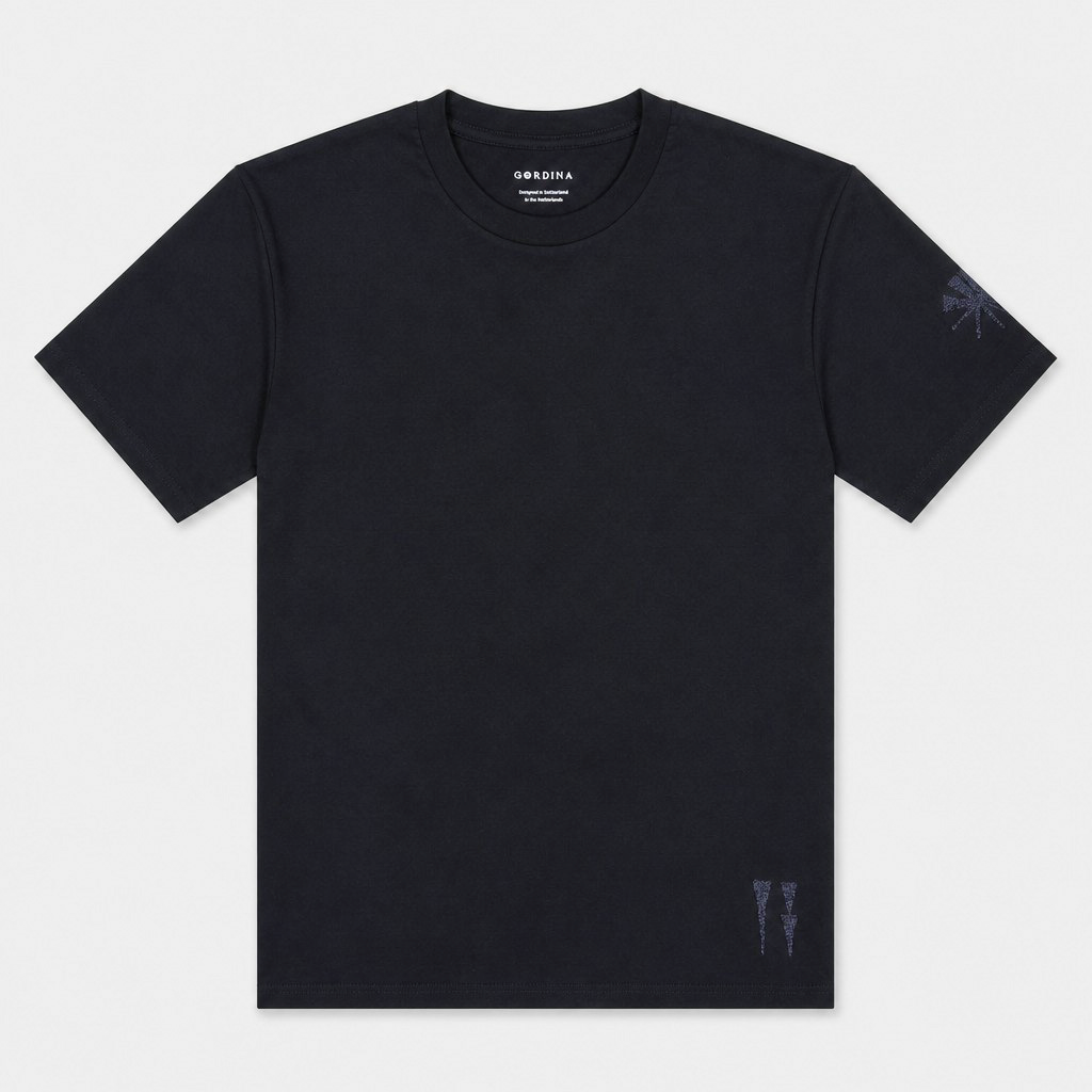 Flat lay of the Water and the Star navy T-shirt showing the sleeve and hem embroidery.