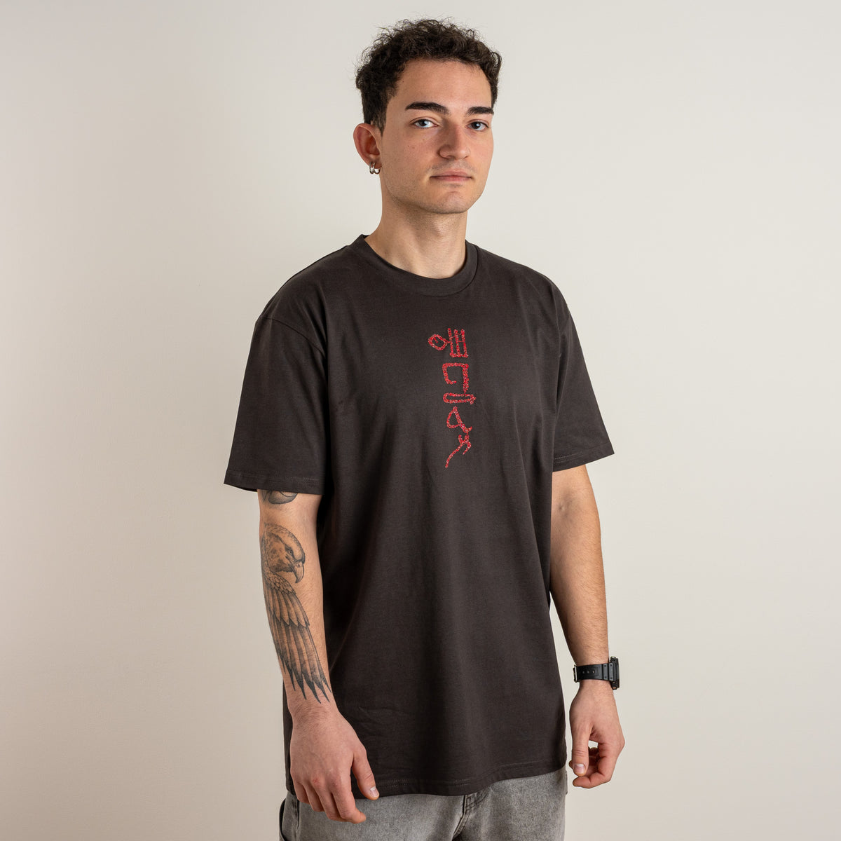Papyrus coal T-shirt with red embroidered motif, front view