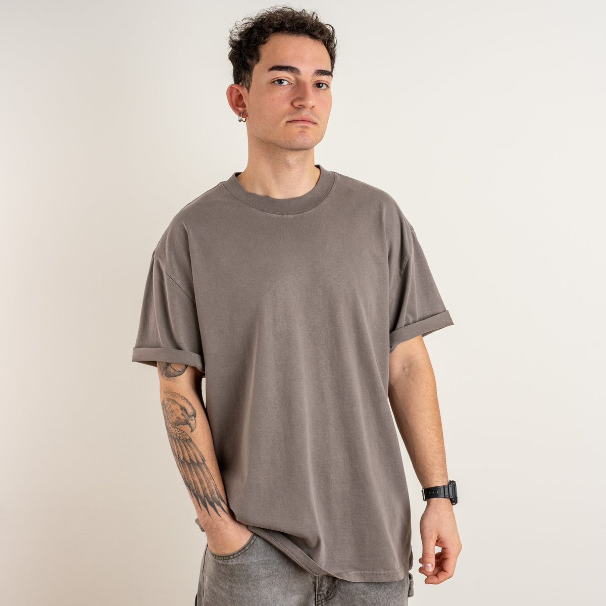 Three-quarter front view of the Gordina The Scarab faded grey oversized T-shirt.