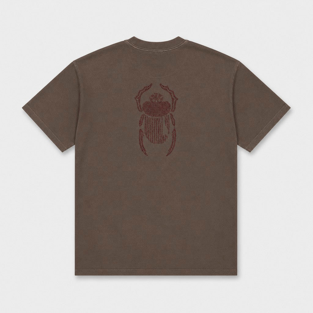 Flat lay of the Gordina The Scarab grey T-shirt with burgundy embroidery placed at the back.