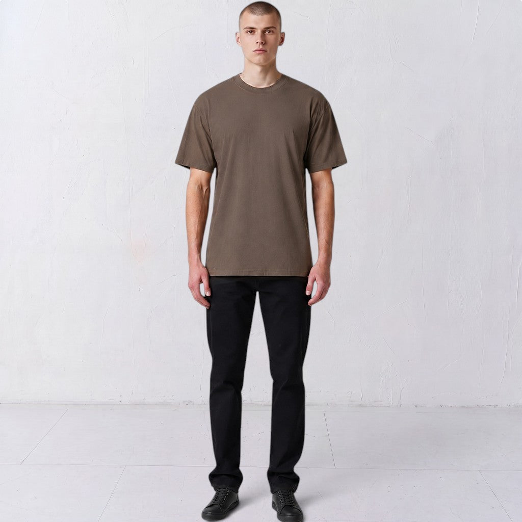 Front view of a model wearing the Gordina The Scarab grey heavyweight T-shirt.
