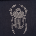 Load image into Gallery viewer, Close-up of ivory scarab embroidery on the Gordina navy oversized cotton T-shirt.
