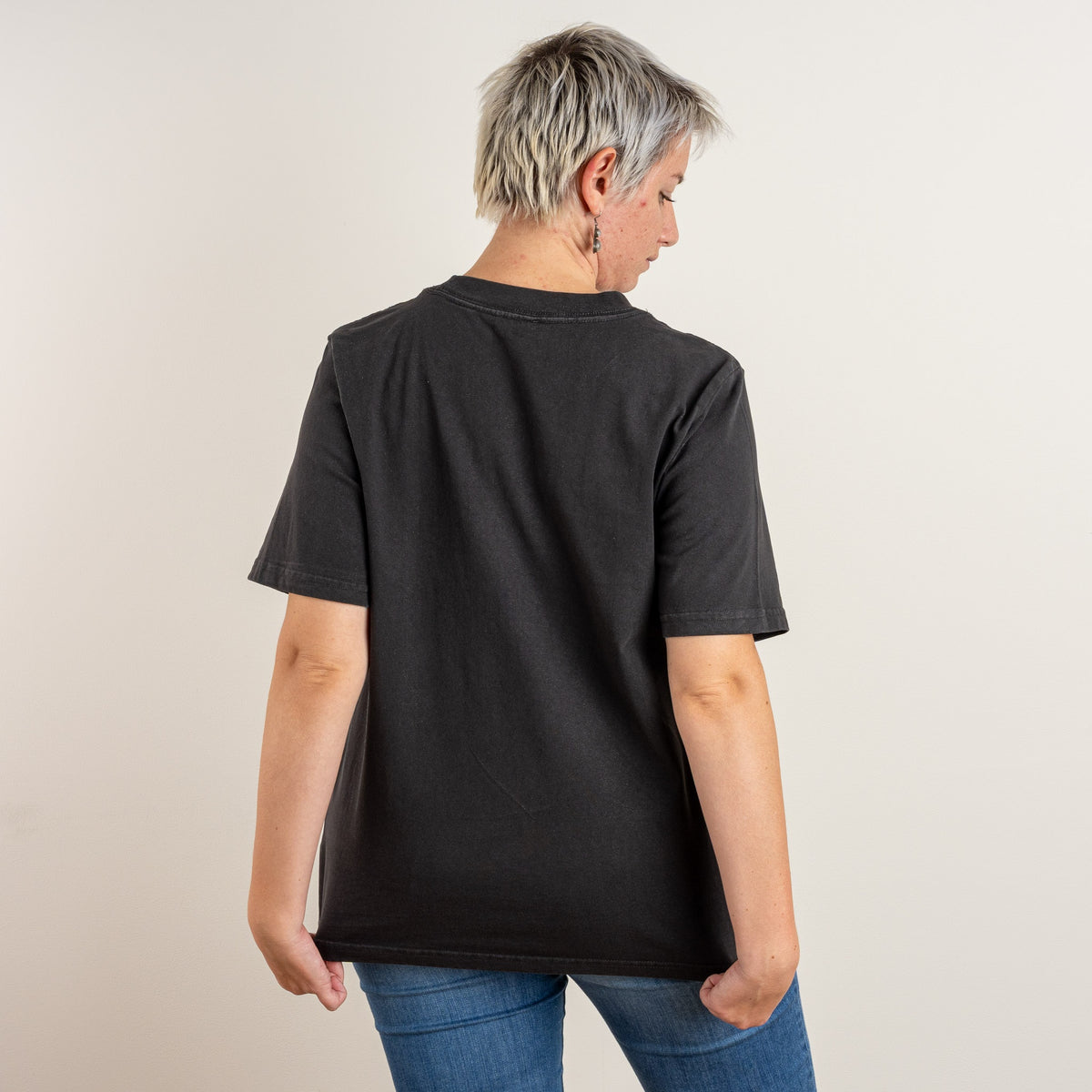 Back view of The Ward women’s Faded Coal relaxed-fit T-shirt by Gordina, showing the clean back of the heavyweight cotton shirt.