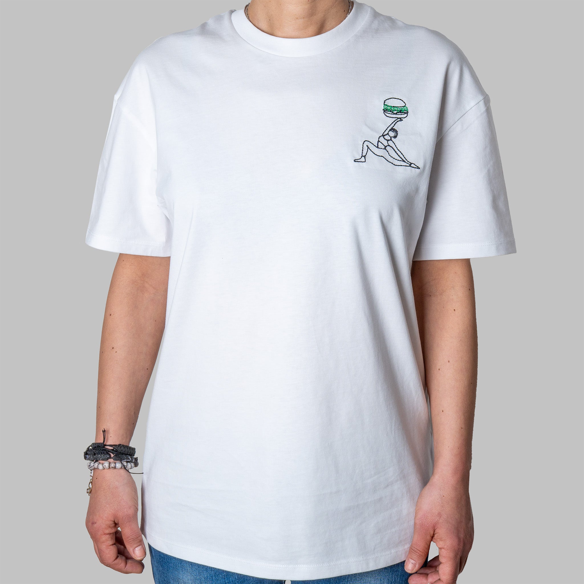White organic cotton t-shirt with playful yoga figure holding burger embroidery on chest, Gordina