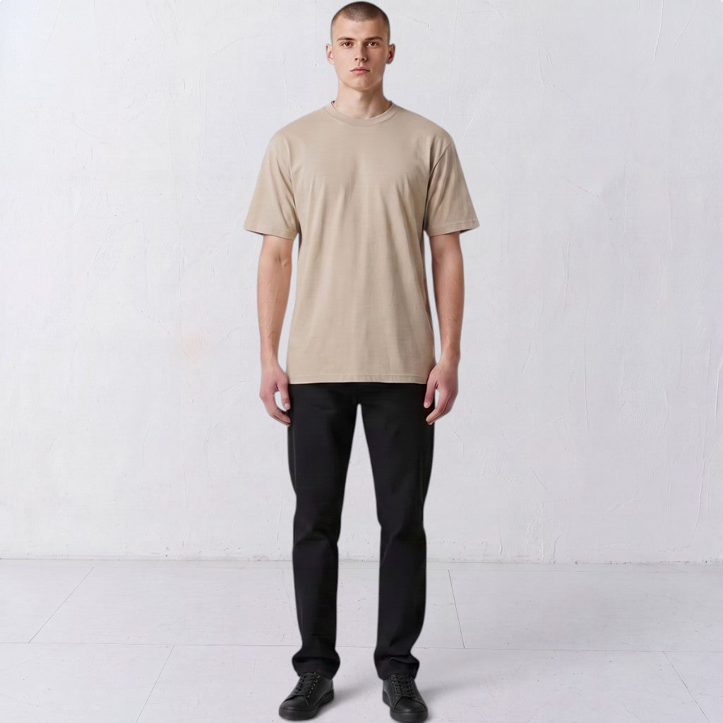 Front view of a model wearing the plain-front beige Gordina Unsigned T-shirt.