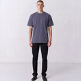 Load image into Gallery viewer, Front view of a model wearing the Gordina Unsigned faded indigo heavyweight cotton T-shirt.
